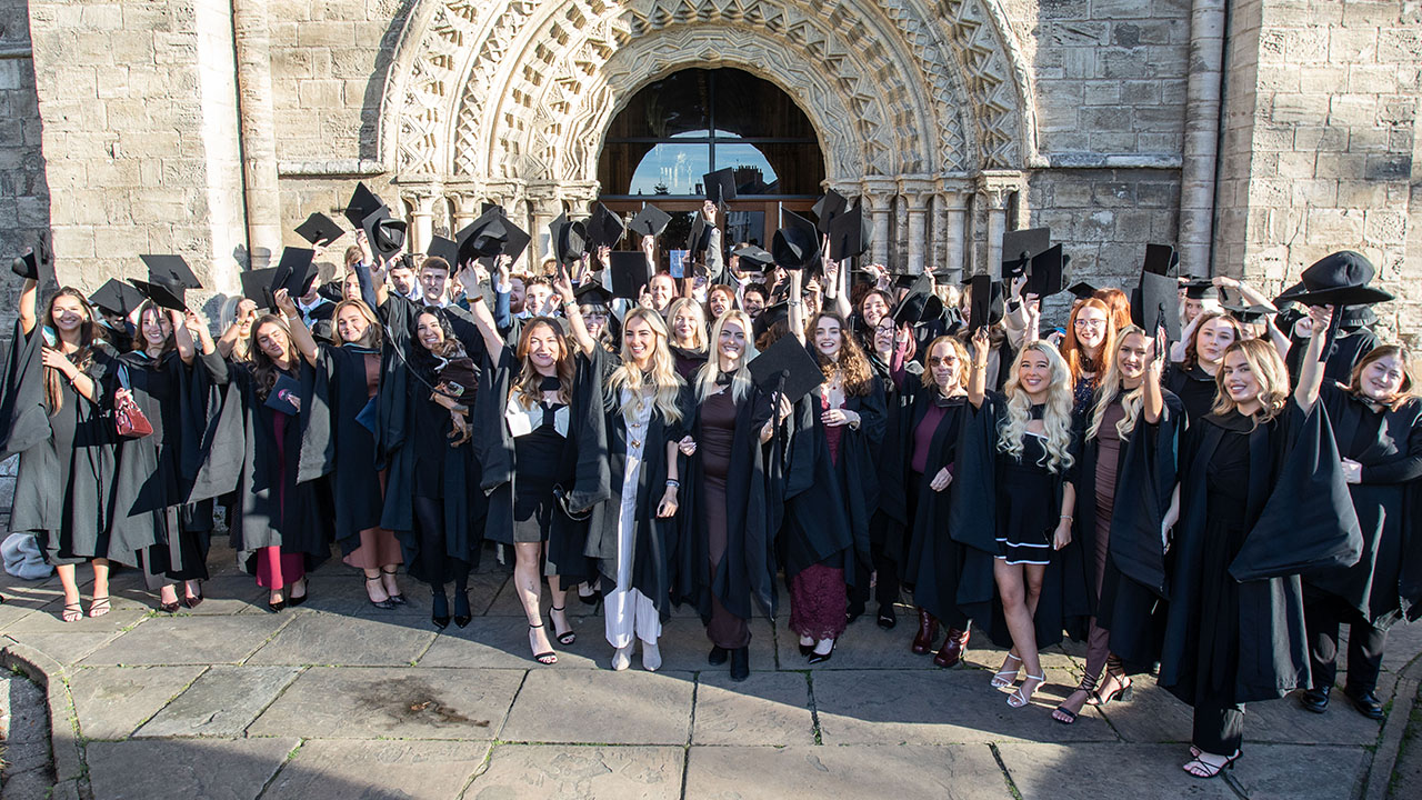 Students celebrating their graduation at Selby Abbey