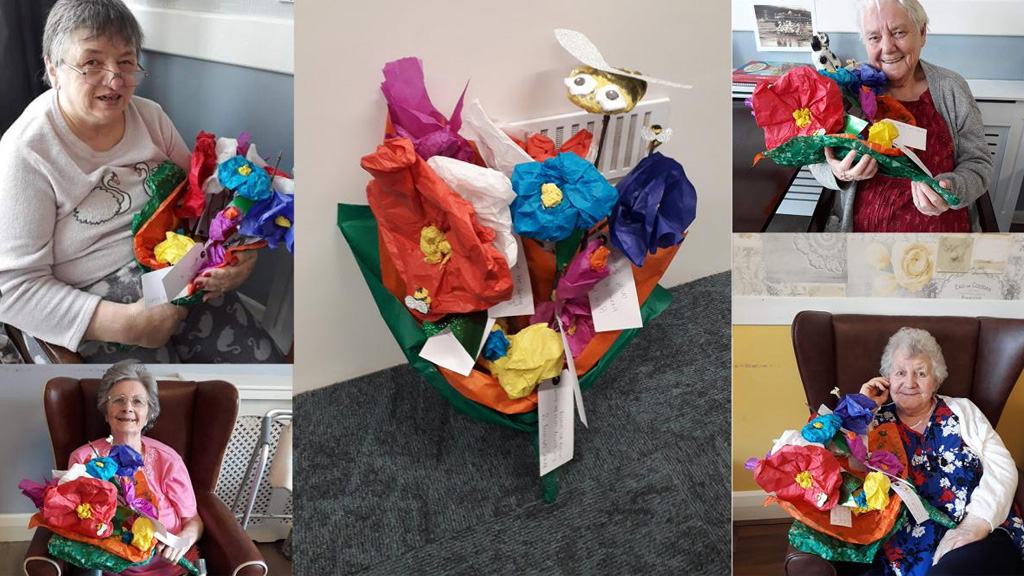 Care home residents with their flowers 