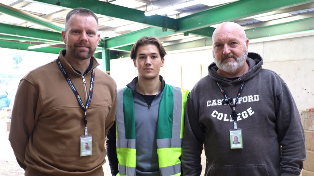 Construction student with his tutors 