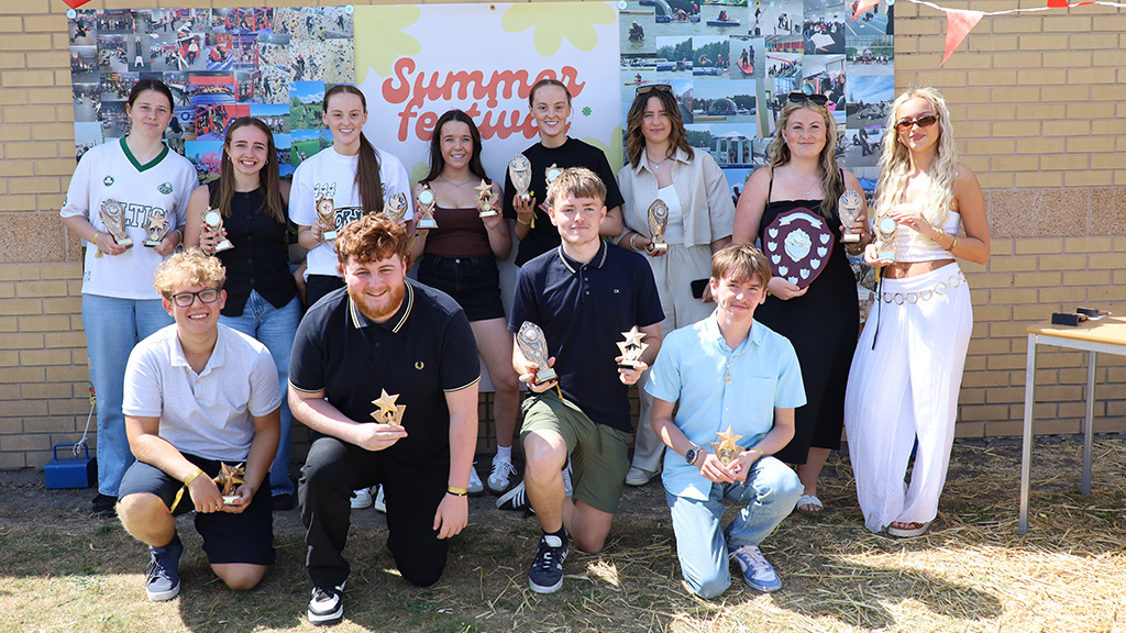 Group of sports students with their awards