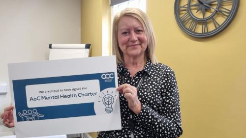 Principal and CEO Sam Wright with AoC Mental Health Charter