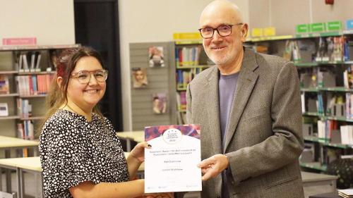 Student receiving their prize 